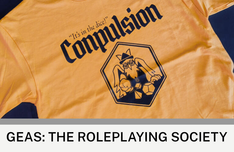 GEAS: The Roleplaying Society Images: A yellow t-shirt with the Conpulsion 2025 logo. Text: GEAS: The Roleplaying Society. ©GEAS/Conpulsion